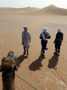 Maroc désert 9 jours sud Marocain. Jour 01: Arrivée à Marrakech selon votre arrivée en vient vous chercher à l'aéroport de Marrakech, pour vous ramener à votre riad. Jour 02: Marrakech >> cascades d'ouzoud >> Aït bougmez départ de votre circuit Maroc désert 9 jours sud Marocain. dans la matinée vers les cascades d'ouzoud. On arrive après 3 heures de route de Marrakech, Descente au pied de la cascade, par un escalier. Observation des Singes Sauvages Macaques de Barbarie. Remontée après avoir descendu jusqu' en bas de la cascade et retour par un autre chemin. Possibilité de Balade avec un Guide Local dans les sentiers alentour. Restaurants en terrasse le long du sentier de descente. Dans l'après midi retour à l'hôtel. Jour 03: Aït bougmez >> Oasis de fint après le petit déjeuner départ pour ouarzazate, en traversant le haut atlas. paysages magnifiques. picnic sur la route. en passant par Skora et Ouarzazate. en arrivant dans l'après midi à l'oasis de fint balade à pied dans le oasis et nuit sur place. Jour 04: Fint >> Foum zguid >> Erg chegaga ( Bivouac ) après une nuit dans un Oasis, départ pour le grand désert du Sahara. en passant par taznakht le capital des tapis Berbere possibilité de visiter l'une des coopératives dans un village. dans le midi en arrive à foum zguid pour prendre l'ancien piste de Paris dakar vers le lac iriki. en arrivant dans l'après midi au bivouac dans les dunes de chegaga, dîner et nuit au milieu des dunes. Jour 05: Balade dans les dunes journée trek et dromadaire dans le désert. Vous allez passer la journée dans les dunes à pied ou à dos de dromadaires, un picnic vous sera servi dans le désert Marocain et retour dans l'après midi au bivouac. Jour 06: Désert de Chegaga >> Zagora >> Agdz départ en 4x4 pour agdz, en visitant le village de tamgrout et la fabrication de poterie, bibliothèque coranique puis route à zagora pour visiter la kasbah à Amezrou. dans l'après midi route de la vallée de draa, en arrivent à votre hôtel. nuit dans hôtel dans la palmeraie du draa. jour 07: Agdz – Ait ben haddou – la vallée d'Ounila – Marrakech Départ de Agdz le matin, traverser le petit Atlas, pour rejoindre la kasbah d'ait ben haddou et la vallée d’Ounila (Cette vallée était le passage obligé des caravanes entre Marrakech et Ouarzazate, et constitue un environnement extraordinaire. Tout au long de cette vallée, un contraste saisissant entre l’ocre de la terre et des roches et la verdure des plantations s'offrent aux marcheurs qui prennent le temps de l’observer). Continuation jusqu’à Telouet, visite de la kasbah Glaoui (parfois aussi appelée Palais du Glaoui, c’est une kasbah bâtie entre le XIXe siècle et le XXe siècle, son occupant le plus célèbre est sans doute Thami El Glaoui). Arrivez l'après-midi à votre Riad à Marrakech. Jour 08: Visite la ville de Marrakech. Après le petit déjeuner au riad, vous commencez votre visite de Marrakech “la ville rouge du Maroc”, elle a été fondée au XIIe siècle par la dynastie des Almoravides. Vous aurez la chance de visiter le tombeau Saadien, les jardins Majorelle, le palais Bahia, ( en voiture ) et la Koutoubia, les marchés de la ville, puis vous irez rejoindre la célèbre place Jemaa El Fna. Après la visite vous retournez à votre riad. Jour 09: Transfert à l'aéroport de Marrakech selon vos horaires de départ, on vient vous chercher de votre hôtel pour vous ramener à l'aéroport de Marrakech. fin de votre Maroc désert 9 jours sud Marocain.