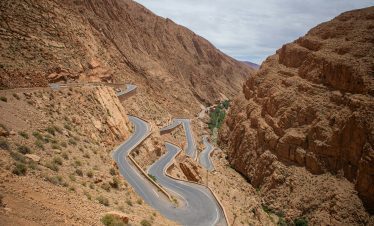 A winding road in the middle of a desert