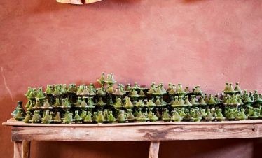 green bowl lot under wooden table