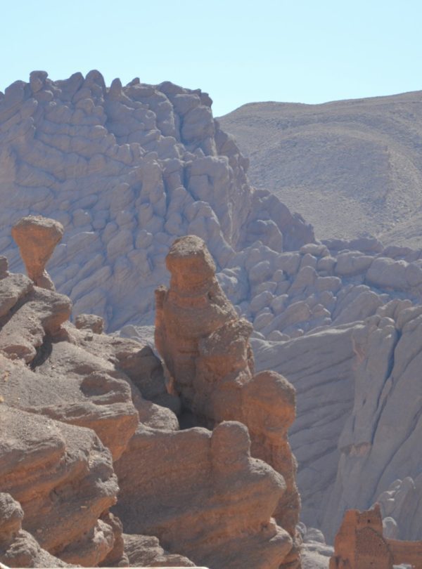 a man standing on top of a rock formation